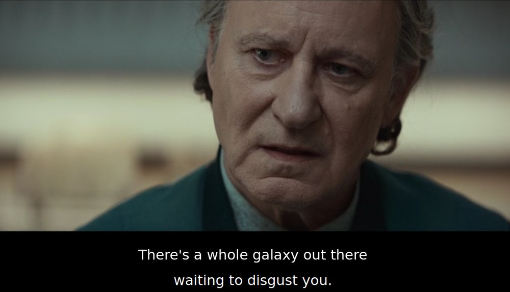 A man in what looks to be somewhere between middle and old age. He's saying, "There's a whole galaxy out there waiting to disgust you.