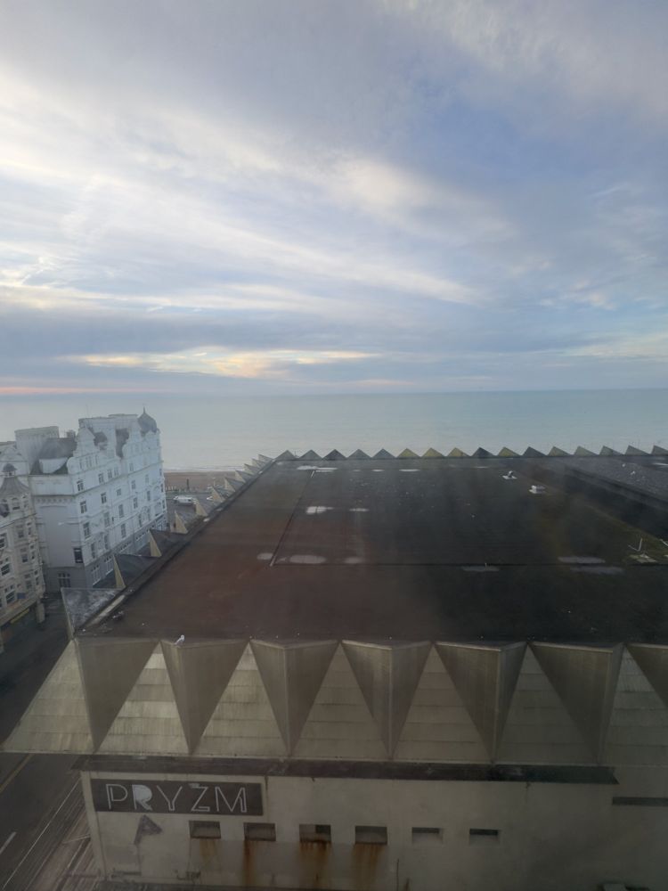 Brighton sea as seen from a hotel window, on a blue sky day