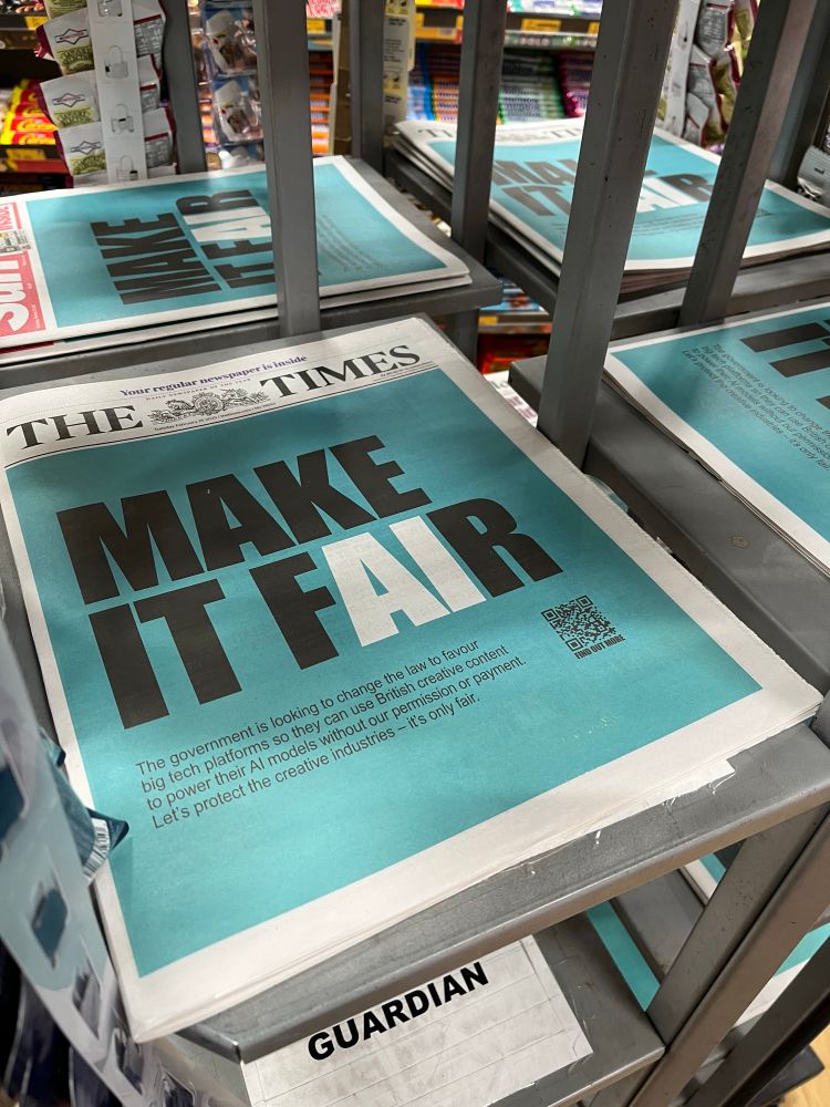 Pic of news stand at the station: all the papers have a full front page Make It Fair ad.
