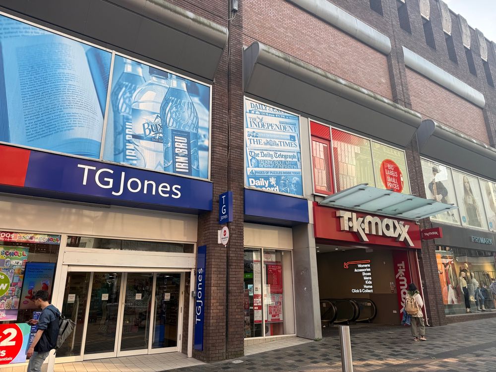 a photo on Glasgow’s Sauchiehall Street, showing a newly rebranded “TG Jones” shop (previously WHSmith) next to TK Maxx