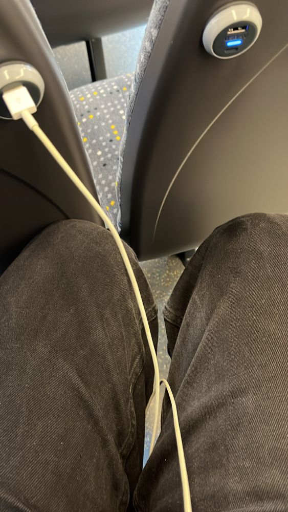 New bee network bus with legs unable to fit in seat space.