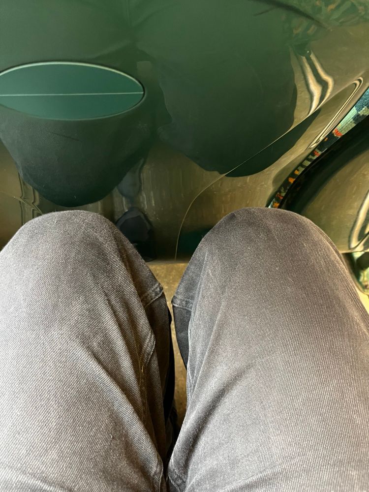 Older bus seat but with more leg room so legs fit.