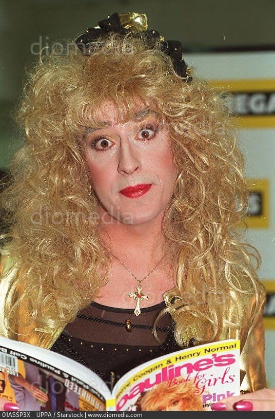 Pauline Calf, reading a copy of her own book.