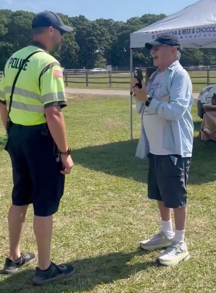 Alan Dershowitz looking like absolute shit filming the police cause he was shut down at the farmers market
