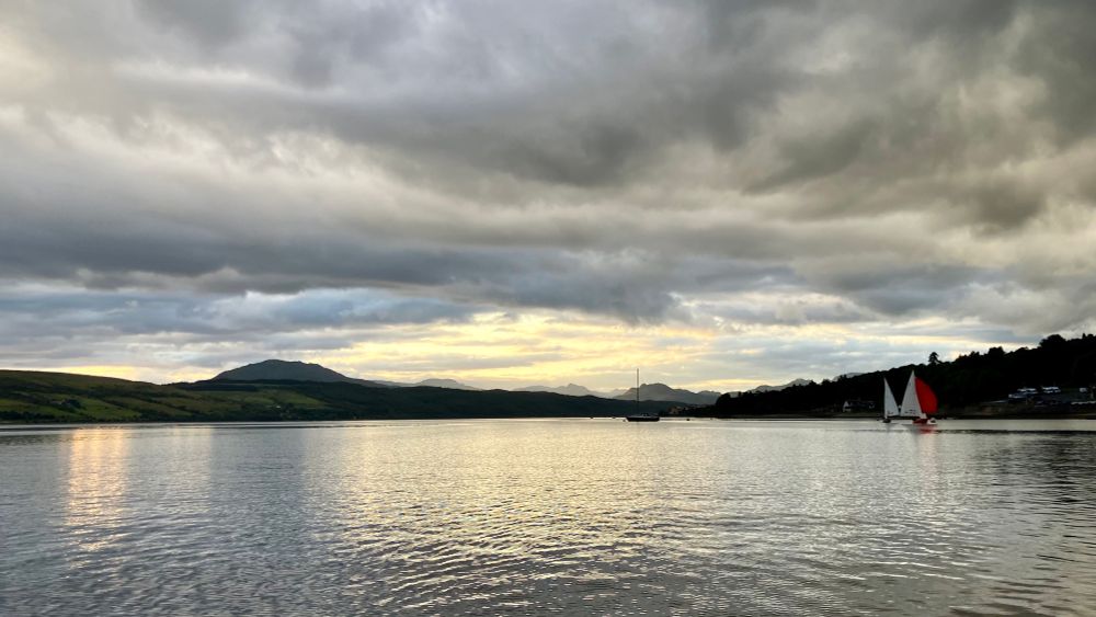A Scottish sea loch (lake/fjord) in the late evening with mountains silhouetted!