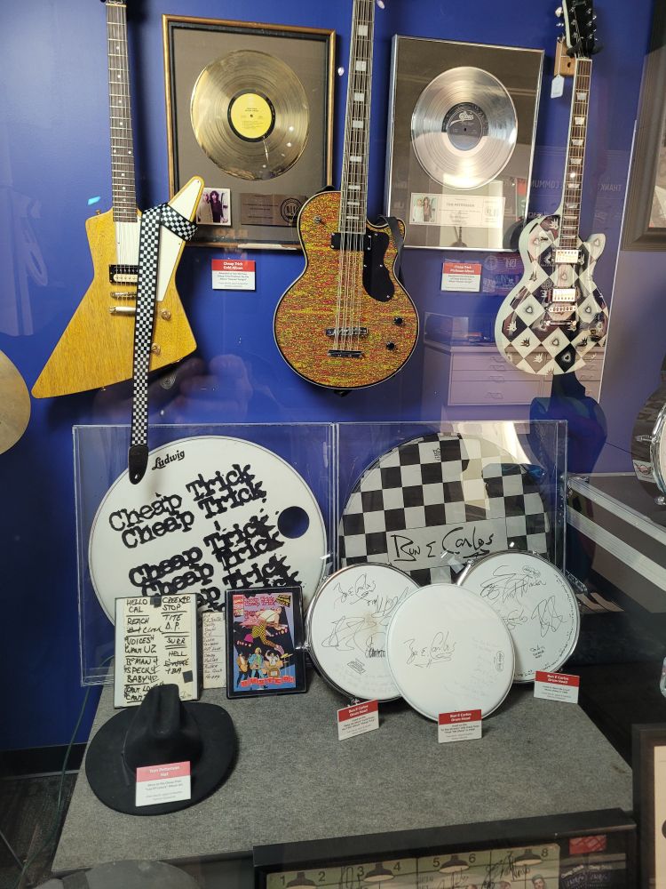 Cheap Trick items on display at the Illinois Rock and Roll Museum.