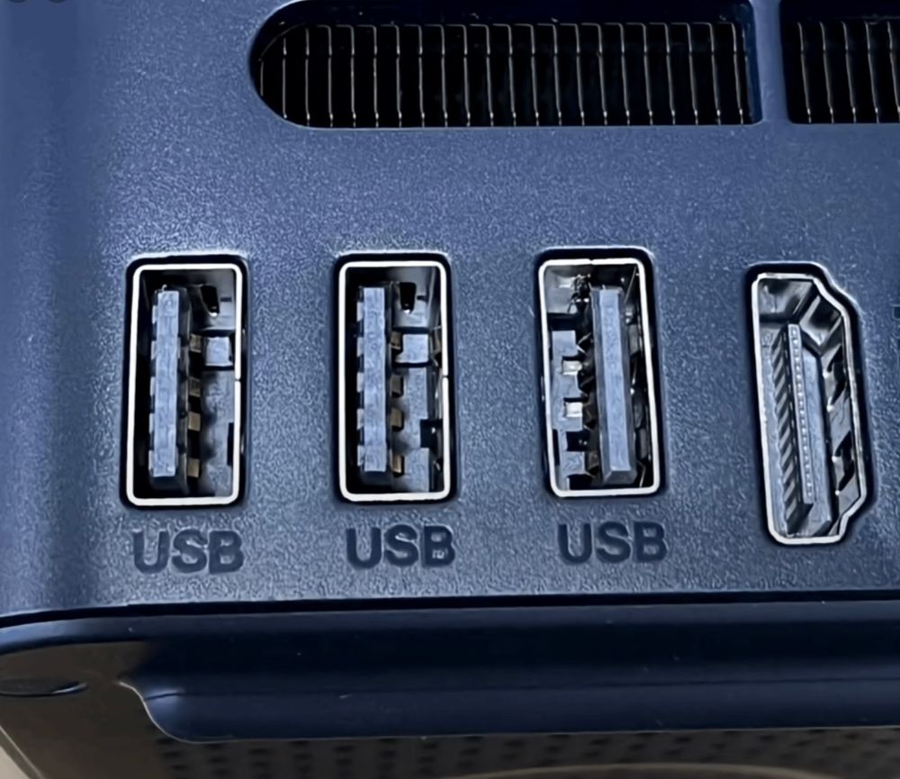 3 USB ports. 2 facing one way and 1 flipped for no reason.