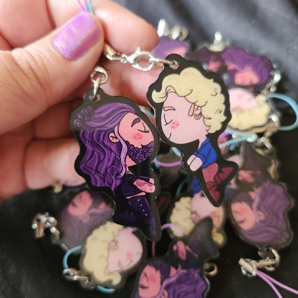 photo of charms of Ed and Stede with magnets in them so they "kiss"
