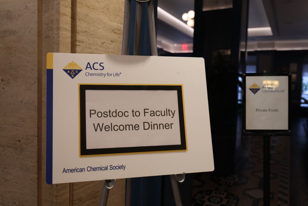 Main sign reads Postdoc to Faculty Welcome Dinner with another sign next to it reading Private event. 