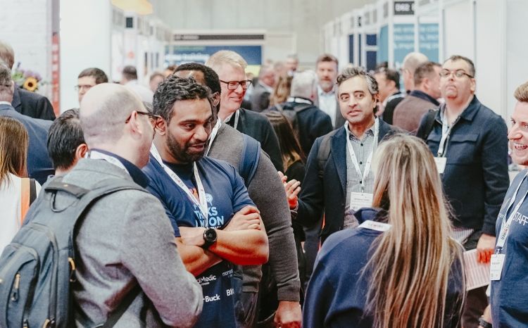 Busy exhibition floor at Rewired25