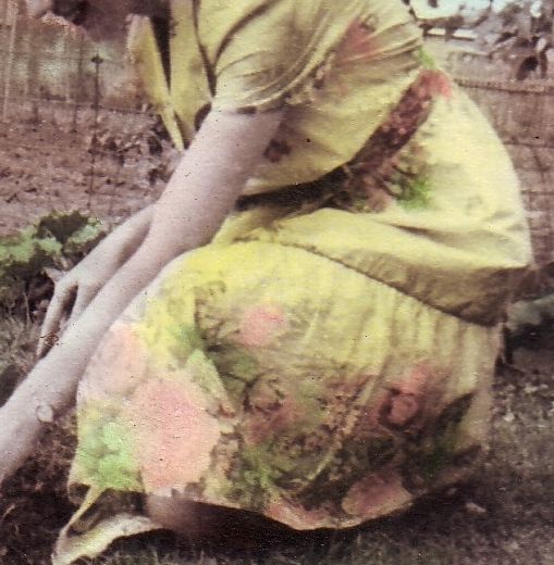 Mom is wearing one of 2 house-dresses that she wore constantly, even while gardening. This one is yellow with an array of pink roses at the bottom and a smaller row at the waist. House-dresses were very simply made and mom sewed all of hers and our clothes by HAND with a needle and thread...no machine for her yet. My mom was very beautiful and had a knockout smile, but I left her face out in case my siblings join and it might upset them that I shared.