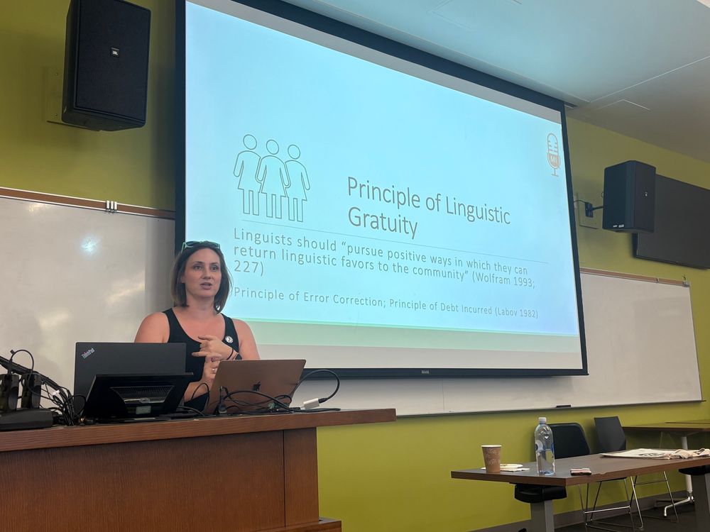 Betsy Sneller at podium, slide says “Principle of Linguistic Gratuity
Linguists should "pursue positive ways in which they can return linguistic favors to the community" (Wolfram 1993;
227)
Principle of Error Correction; Principle of Debt Incurred (Labov 1982)