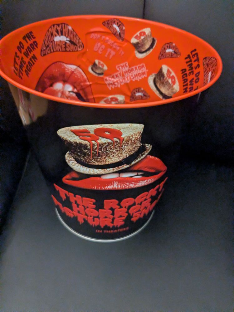 A metal 50th anniversary Rocky Horror popcorn bucket