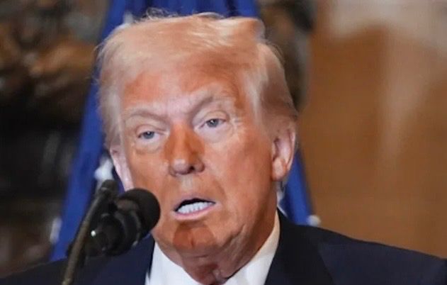A picture of Donald Trump with the area around his eyes looking white compared to the orange make up on the rest of his face.