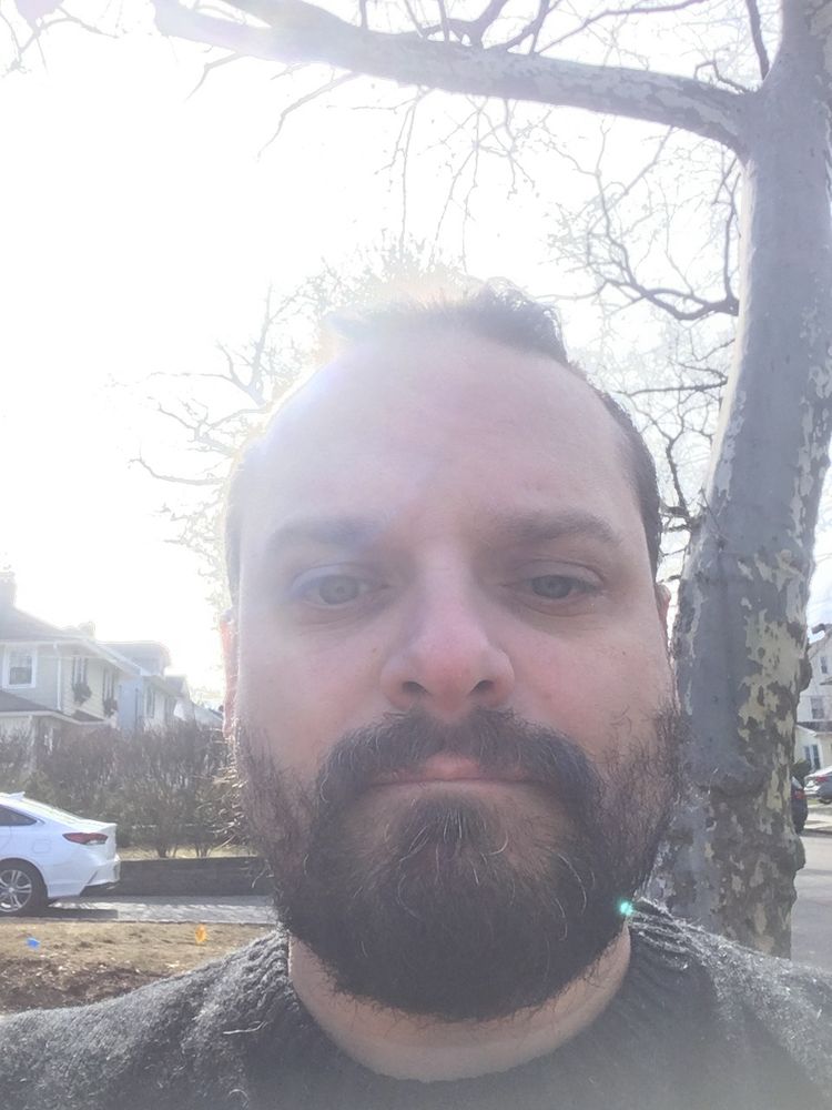 A picture of myself, a middle aged white man with thinning hair pulled back, and a bad beard.