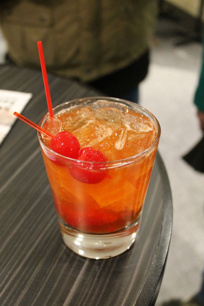 A photo of a very pale old fashioned cocktail made with far too much ice