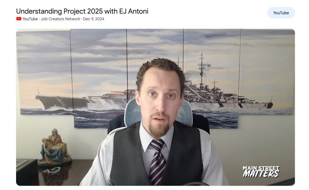 YouTube screenshot of EJ Antoni doing a Main Street Matters interview on the Job Creators Network, where he has Nazi battleship art on his wall. 
