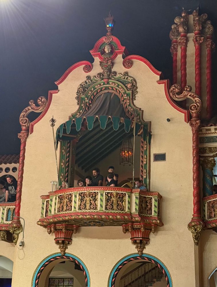 A highly decorated, colorful balcony at the Aragon Ballroom in Chicago. Fans can be seen sitting in their balcony seats (if this was you then hi!)