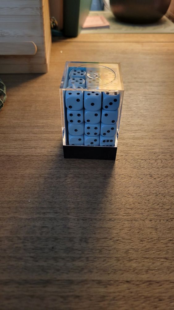 A pack of blue chessex 6 sided die.