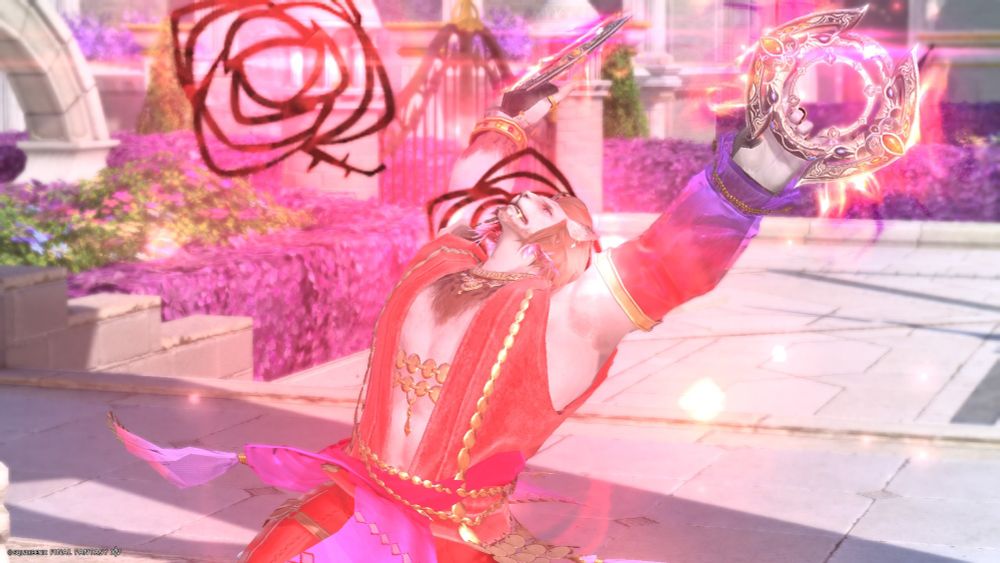A screenshot from Final Fantasy 14 of my character Exirand as a Dancer in the Grand Cosmos dungeon. He is performing the "Emboîté" action, which skill icon is a red rose. We see Exirand from a three quarters angle from the right and from head to below waist level. His torso is leaning back and his arms are up in the air while he's holding chakrams. His head is facing upwards, he is smirking while looking at the camera. There's a red glow surrounding the character and two big visual effects representing dark red roses, one on the right of Exirand at the top of the picture and the other one between his head and right shoulder. In the background we can see that Exirand is in the courtyard portion of the castle, the floor is made of white flagstones, there is vegetation surrounded by hedges of purple bushes and a gate with metal doors can be seen behind the character, in the distance. He is also standing in front of small but wide stairs that are hidden by the perspective, but a low wall forming steps, on the left of the image, indicates their presence. 