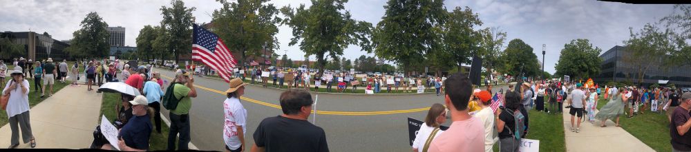 Panoramic view of hundreds of peaceful protesters at ICE Burlington MA