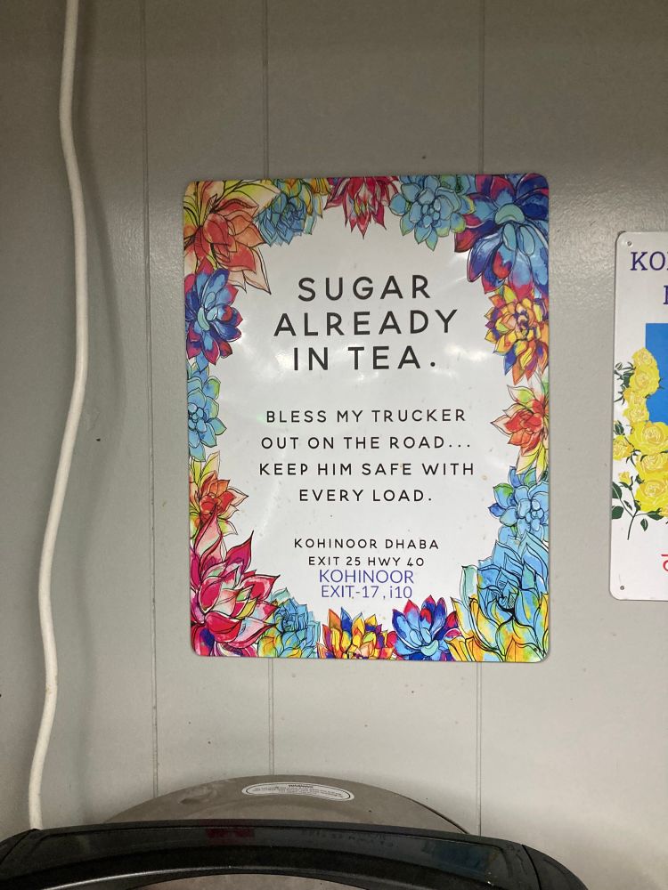 Sign that says Sugar Already In Tea bless my trucker on the road …. Keep him safe with every load