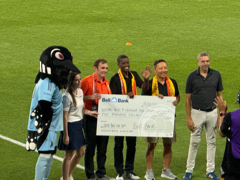 Mayor Carter and PK and reps from the school with a check from MN United for the schools 