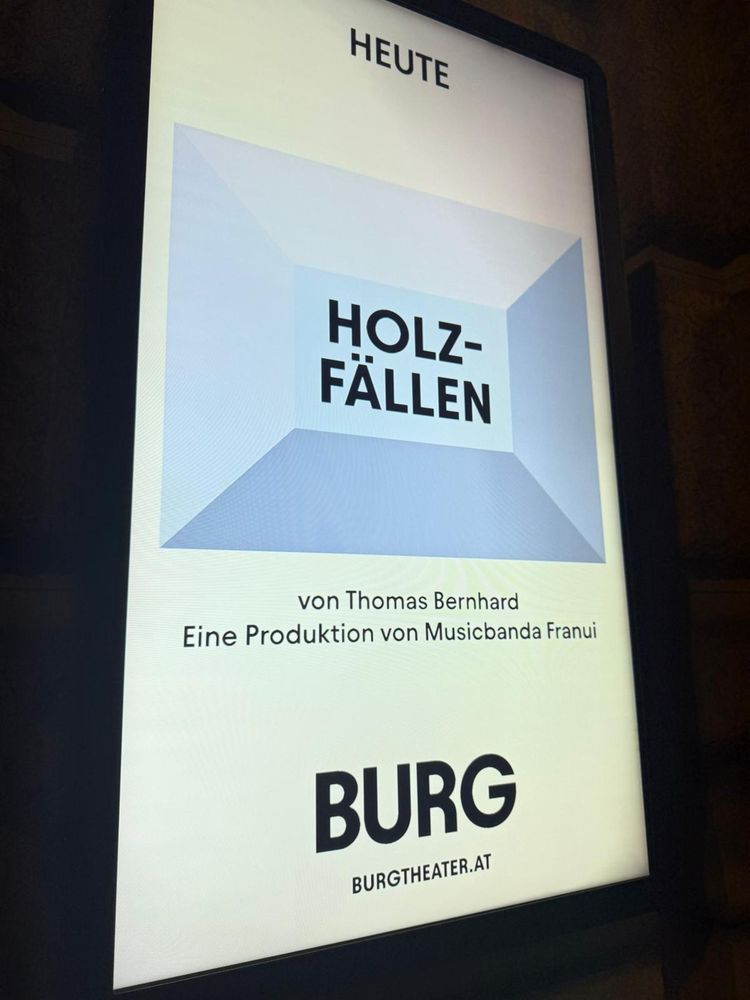 Ankündigungsleuchttafel des Burgtheaters für Holzfällen