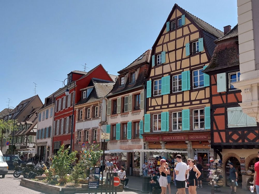 Colourful, picturesque half-timbered houses along a street.