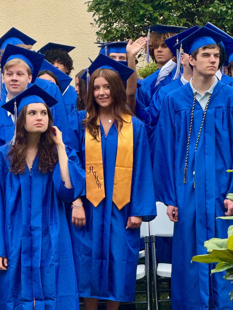 A radiant high school graduate smiling during her ceremony