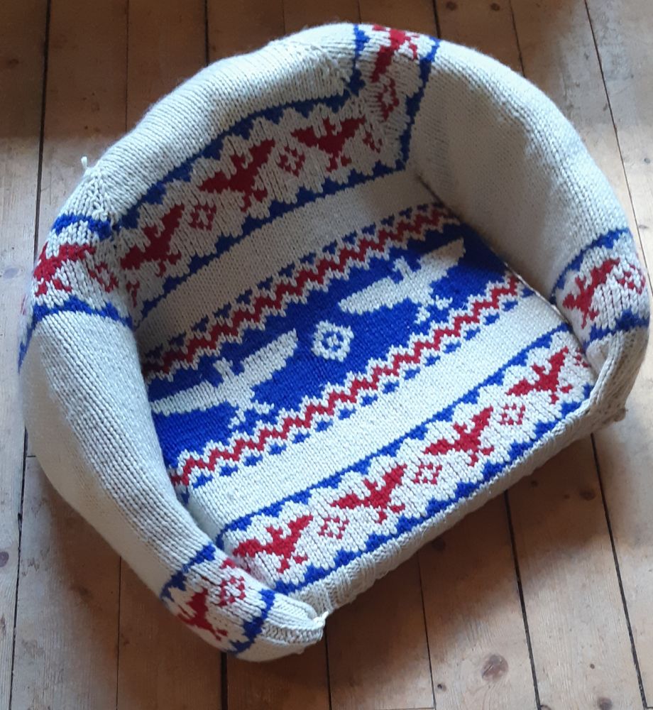 Hand knit red white and blue sweater with Thunderbird motif