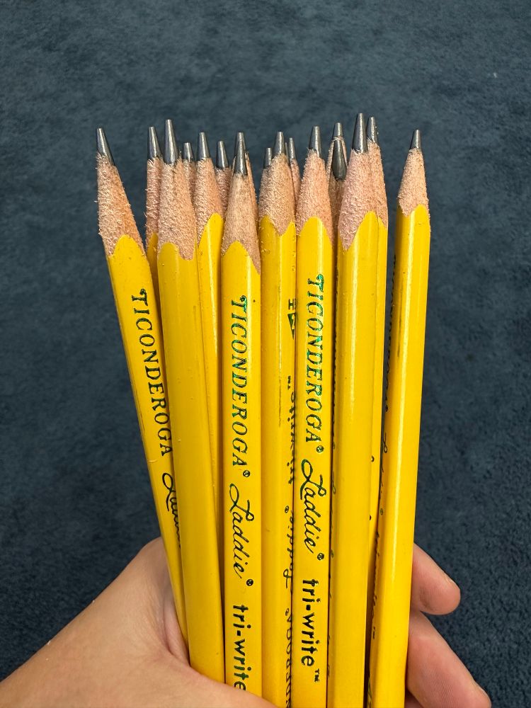 A handful of sharpened Ticonderoga pencils. 