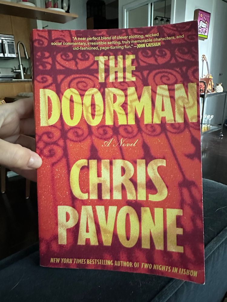 The cover of a book called The Doorman by Chris Pavone. 