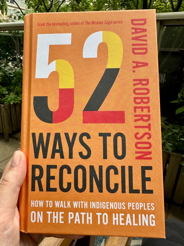 The cover of a book called 52 Ways to Reconcile: How to Walk With Indigenous Peoples on the Path to Healing by David A. Robertson.  