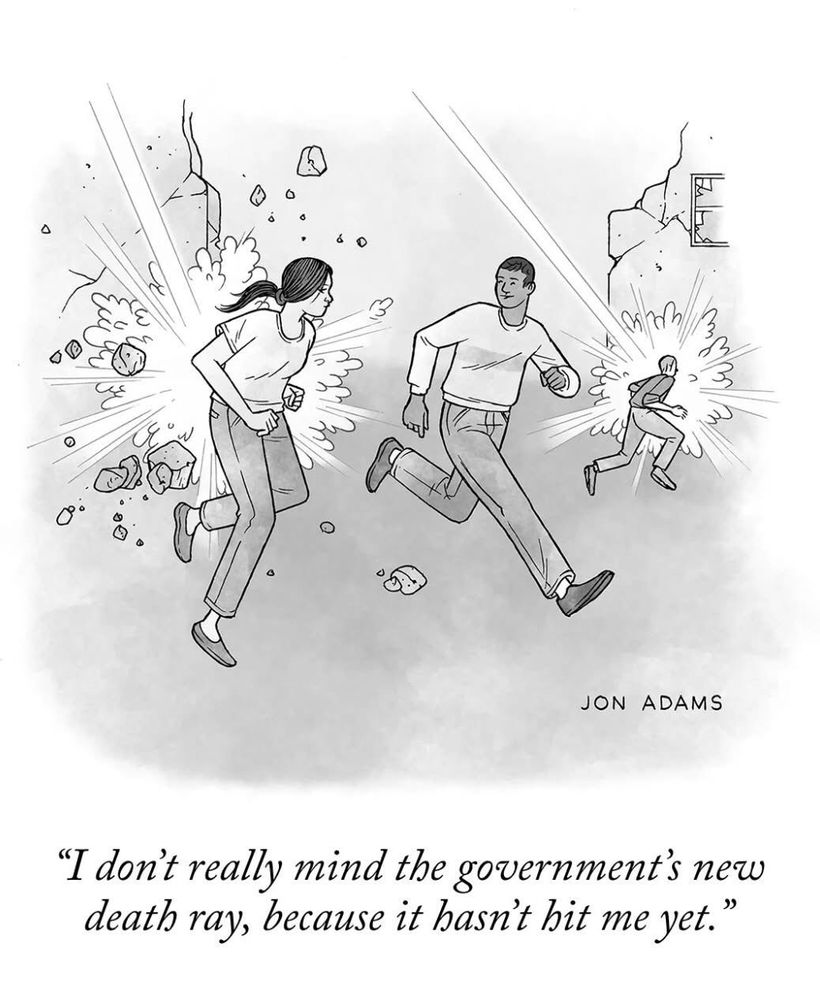 Cartoon of people running around, with explosions happening around them. Text reads: “I don’t really mind the government’s new death ray, because it hasn’t hit me yet.” Signed: Jon Adams 