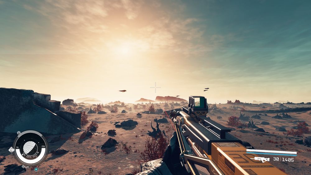 First person with some the game Starfield.

The player is holding their weapon toward the landscape with a morning view over a yellow-ish blue sky. There's a distant mountain surrounded in fog with flying alien creature in the sky.