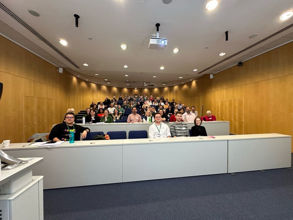 A lecture theatre full of people, at The STEM Village Immunology Symposium in Manchester 