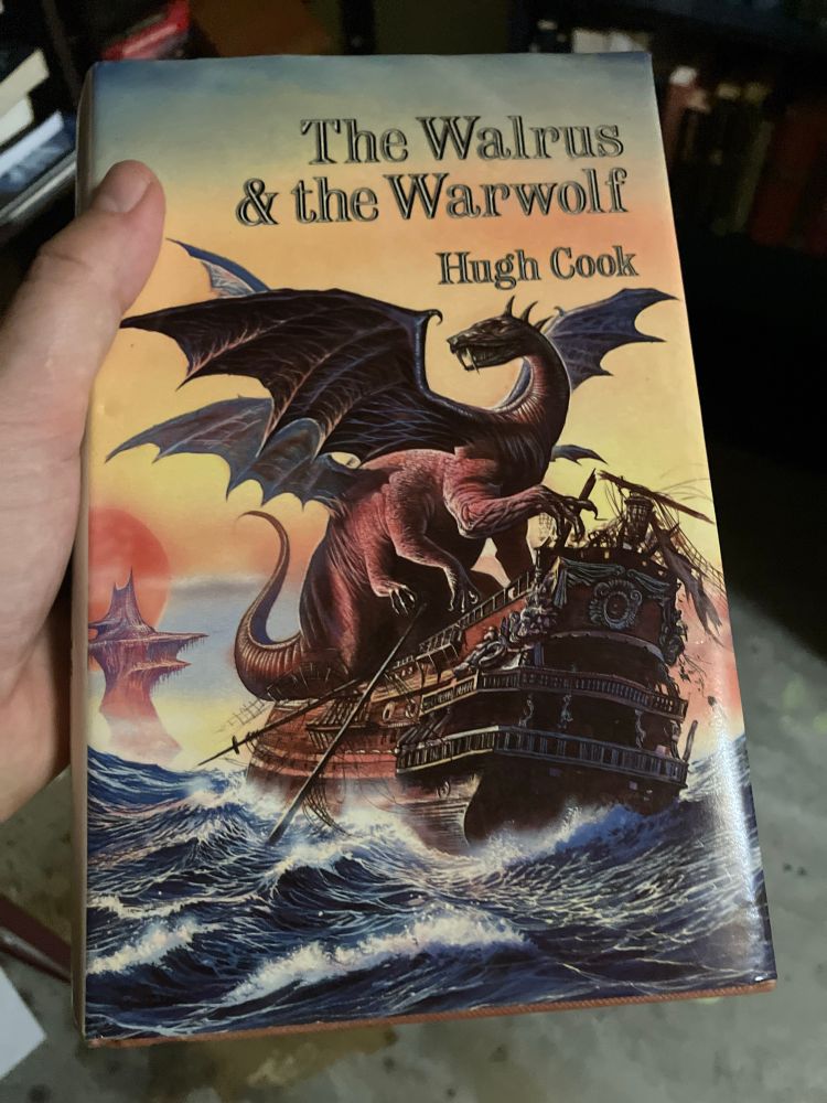 The book the Walrus and the Warwolf with a dragon having a nice sit down on a galleon, hope it brought some pillows.