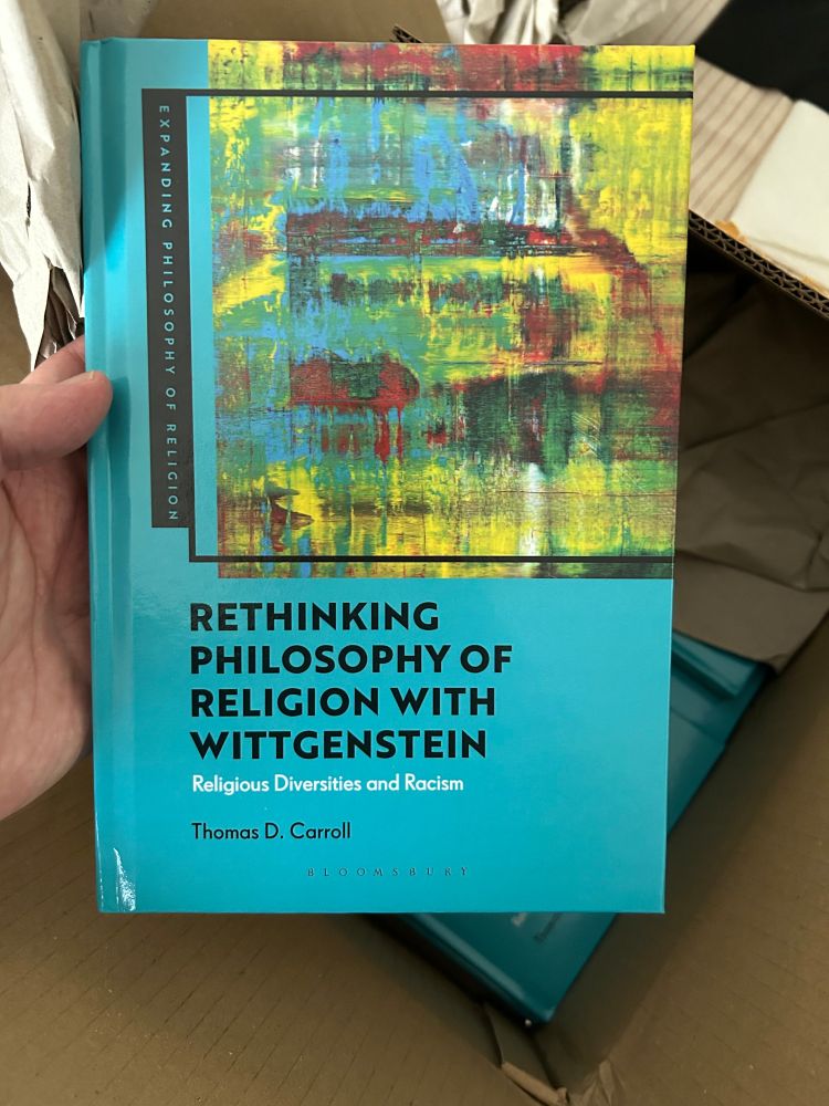 Opening a box with my new book inside