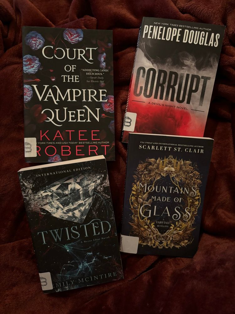 4 books. Titles are: Court of the vampire queen by Katee Robert,  Corrupt by Penelope Douglas, Twisted by Emily McIntire and Mountains made of glass by Scarlett st. Clair. The first 3 are supposed to be dark romances and the last one is a cute small fairytale retelling. 