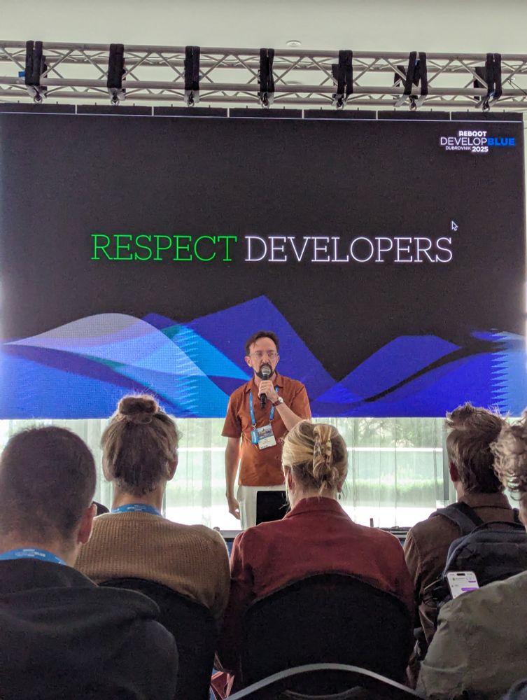 Jörg Tittel speaking at Reboot Develop Blue 2025.