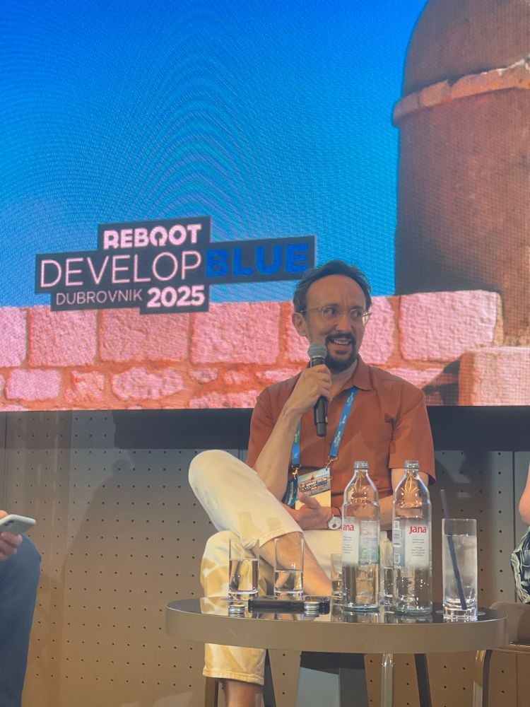 Jörg Tittel speaking at Reboot Develop Blue 2025.