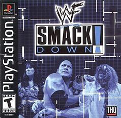 a blue and white image of Chyna, the Rock holding someone in a headlock, Mankind with Mr. Socko, "Playstation" upright on the left side, "WWF Smackdown!" in the upper centre