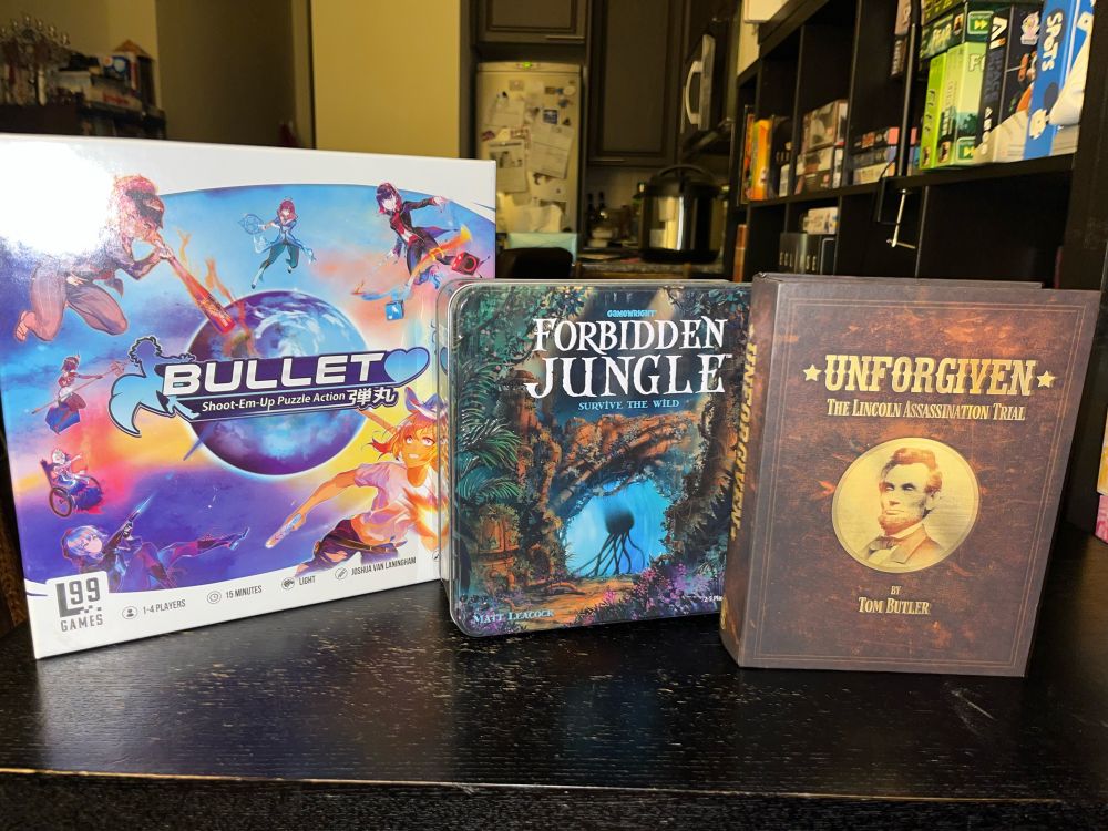 Box fronts of Bullet❤️, Forbidden Jungle, and Unforgiven boardgames.