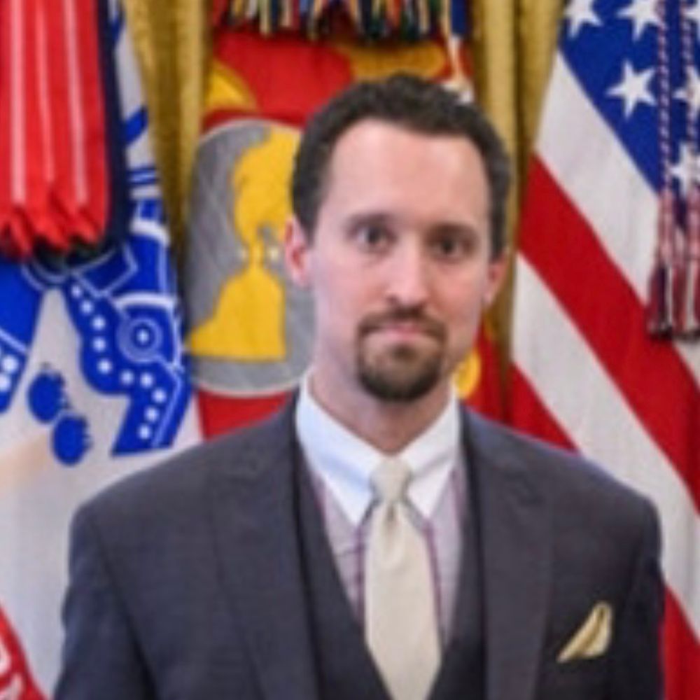 A cropped in shot of E J Antoni as he stands next to Trump in the Oval Office wearing a thousand yard stare that indicates he definitely isn’t in over his head - nope, not him, he’s very confident indeed 