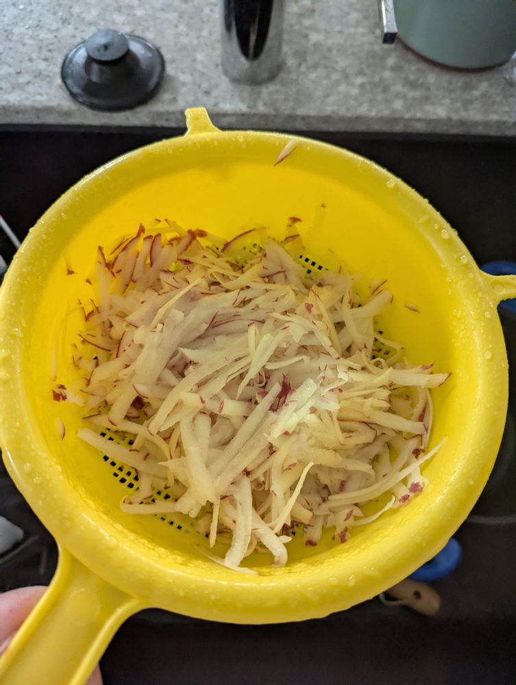 Shredded potatoes! I dripped on the floor to get this image and the Mrs was none too pleased. 