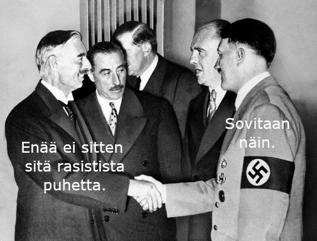 Chamberlain ja Hitler kättelevät. Neville: Enää ei sitten rasistista puhetta. Adolf: Sovitaan näin.