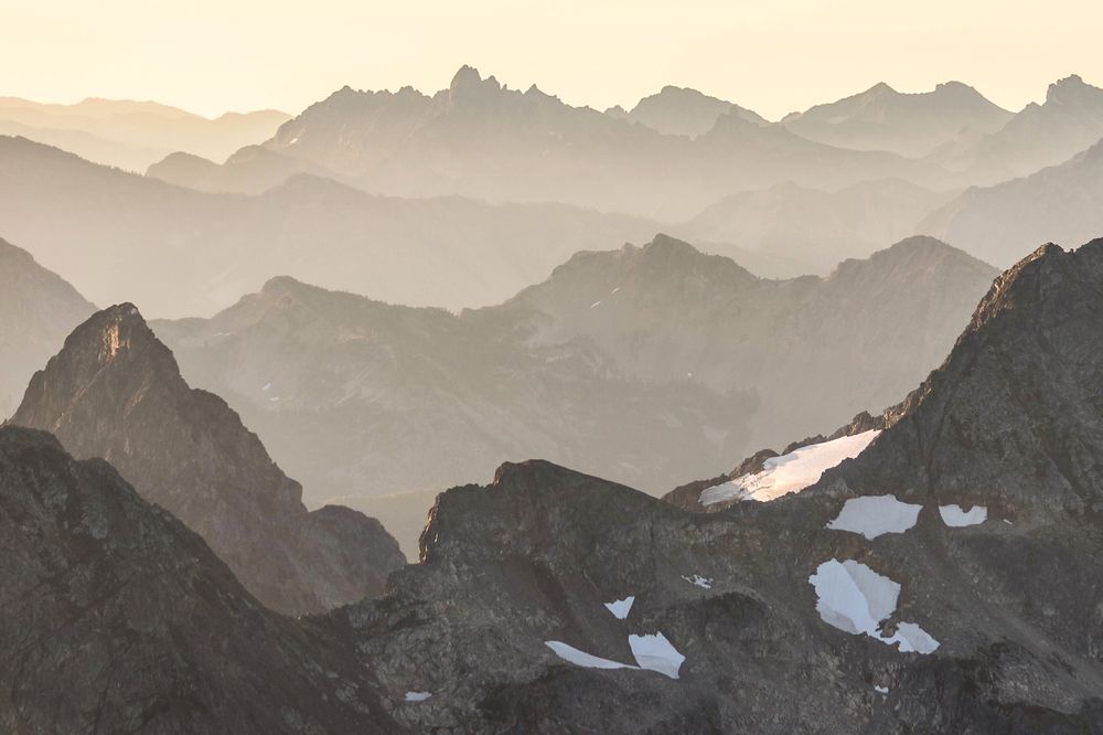 Sunrise from Johannesburg Mountain in the Glacier Peak Wilderness, revealing the breathtaking ridge layers of the North Cascades National Park.