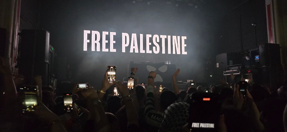 Two images from KneeCap (music group) concert.  Showing screen projections saying "KneeCap" and "Free Palestine"