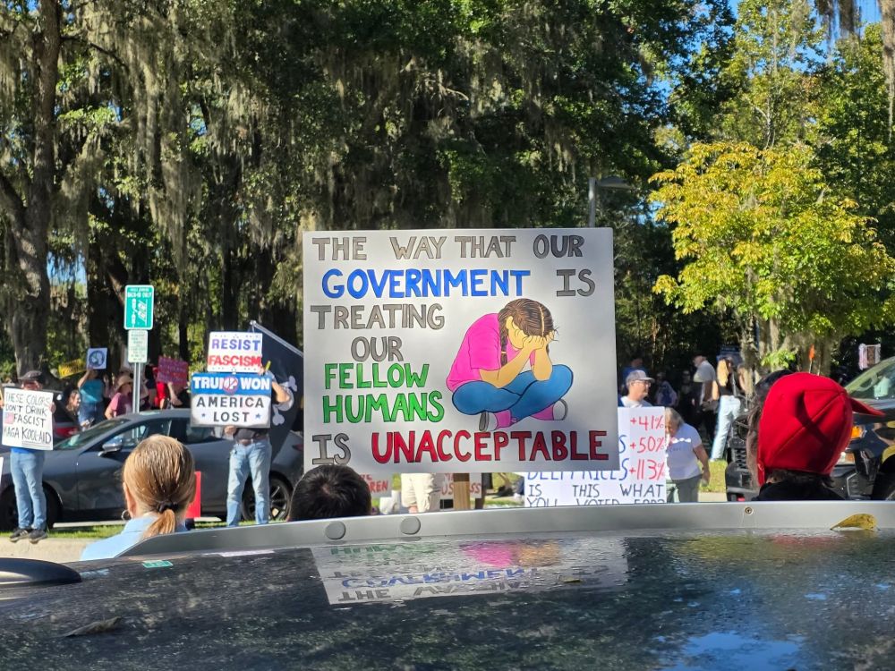 A protest sign that says "The way that our government is treating our fellow humans is unacceptable."
